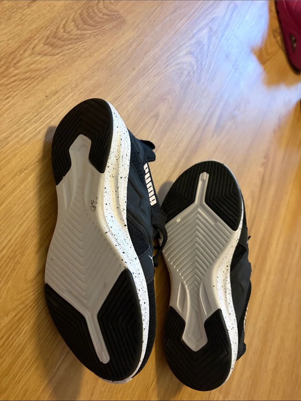 Puma women’s Black Athletic Sneakers with White Accent